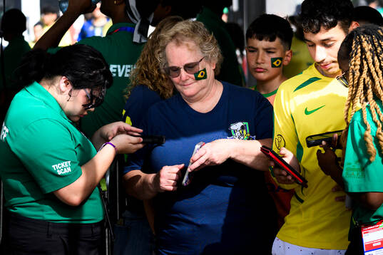 Supporters of Brazil get’s their tickets scanned