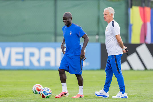 N'Golo Kanté and head coach Didier Deschamps of the French