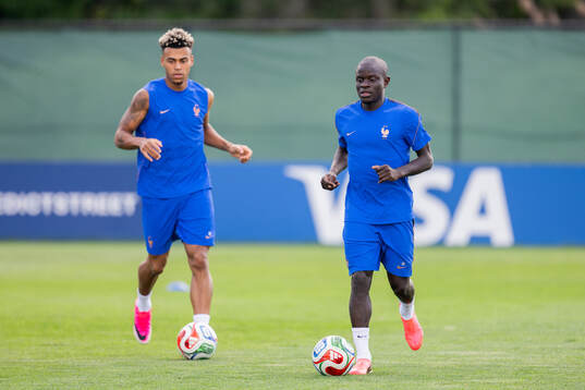 Désiré Doué and N'Golo Kanté of the French national