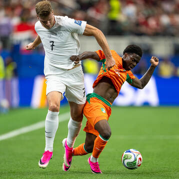 Alexander Sørloth of Norway and Christ Inao Oulai of Côte