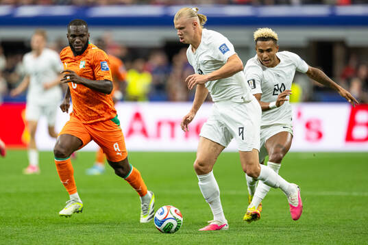Franck Kessie of Côte d'Ivoire and Erling Braut Haaland of