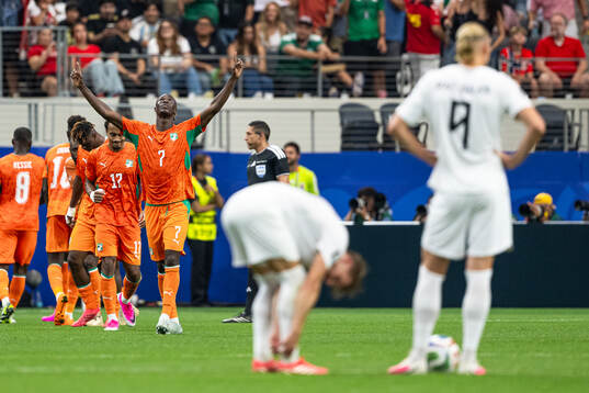 Odilon Kossounou of Côte d'Ivoire celebrates