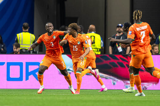 Ghislain Konan and Amad Diallo of Côte d'Ivoire celebrate