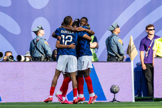 Kylian Mbappe of France celebrates with team mates