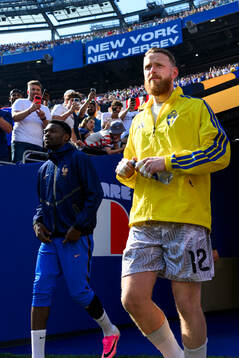 Goalkeeper Viktor Johansson of Sweden enters the pitch