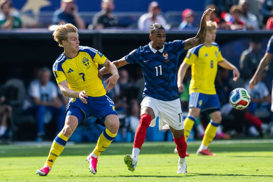 Lucas Bergvall of Sweden and Michael Olise of France uring