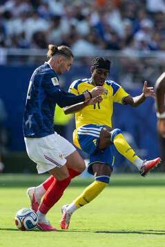 Adrien Rabiot of France and Anthony Elanga of Sweden