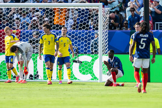 Ousmane Dembele of France looks dejected