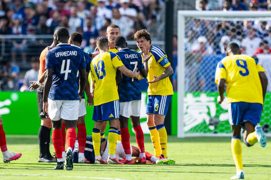 Ousmane Dembele of France and Victor Nilsson Lindelöf of