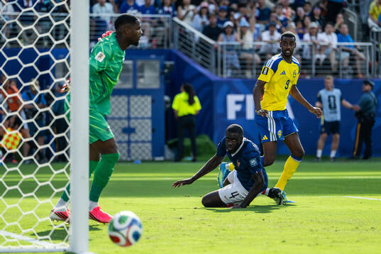 Alexander Isak of Sweden and Dayot Upamecano of France