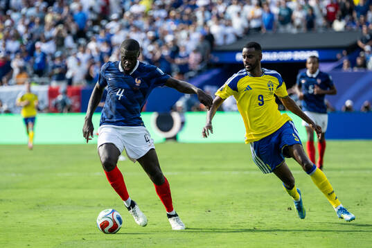 Dayot Upamecano of France and Alexander Isak of Sweden