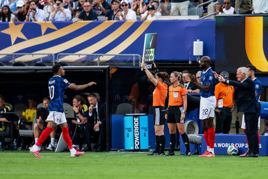 Kylian Mbappe and head coach Didier Claude Deschamps of