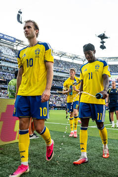Benjamin Nygren and Anthony Elanga of Sweden look dejected