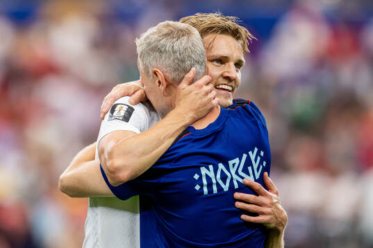 Martin Ødegaard of Norway celebrates with team manager Are