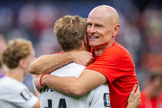 Martin Ødegaard and Ståle Solbakken, head coach of