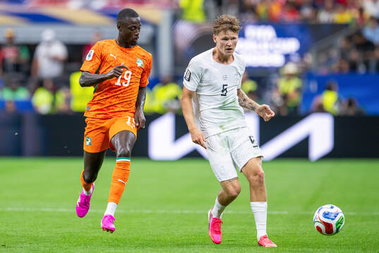 Nicolas Pepe of Côte d'Ivoire and David Møller Wolfe of