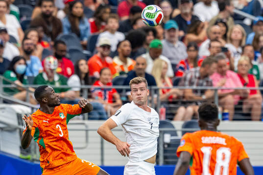 Ghislain Konan of Côte d'Ivoire and Alexander Sørloth of