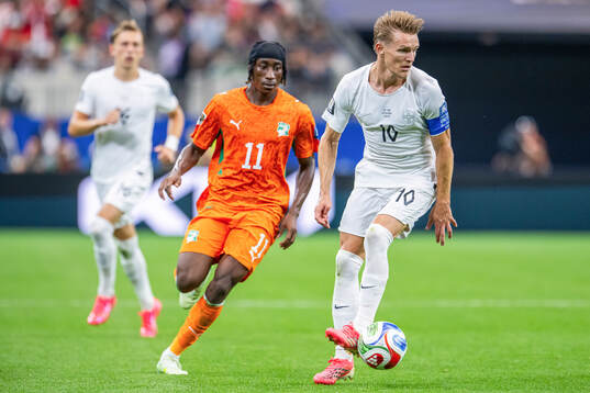 Yan Diomande of Côte d'Ivoire and Martin Ødegaard of