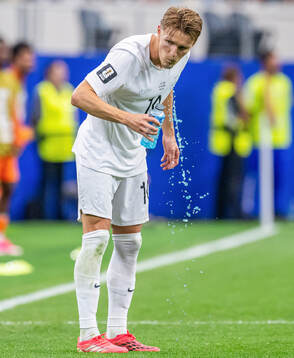 Martin Ødegaard of Norway drinks