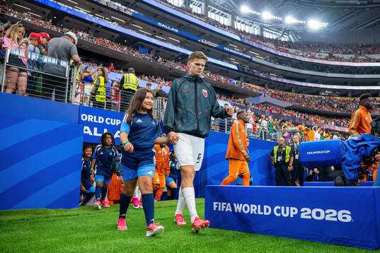 David Møller Wolfe of Norway enters the pitch