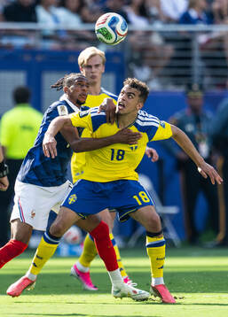 Michael Olise of France and Yasin Ayari of Sweden
