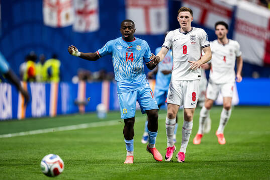 Noah Sadiki of Congo DR and Elliot Anderson of England