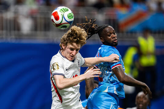 Anthony Gordon of England and Aaron Wan-Bissaka of Congo DR