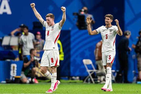 Elliot Anderson and John Stones of England celebrate