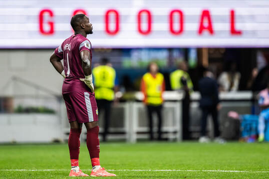 Goalkeeper Lionel Mpasi of Congo DR looks dejected
