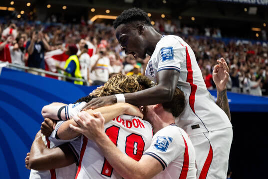 Bukayo Saka of England celebrates with teammates