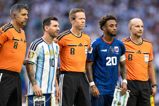 Lionel Messi of Argentina, Referee Drew Fischer and Ryan