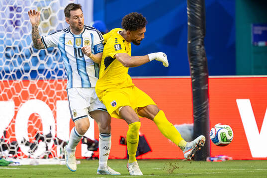 Lionel Messi of Argentina and goalkeeper Vozinha of Cabo