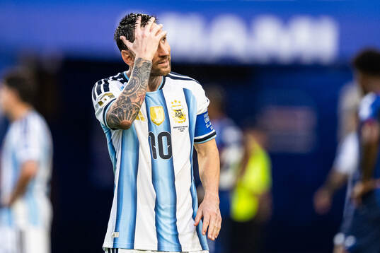 Lionel Messi of Argentina looks dejected