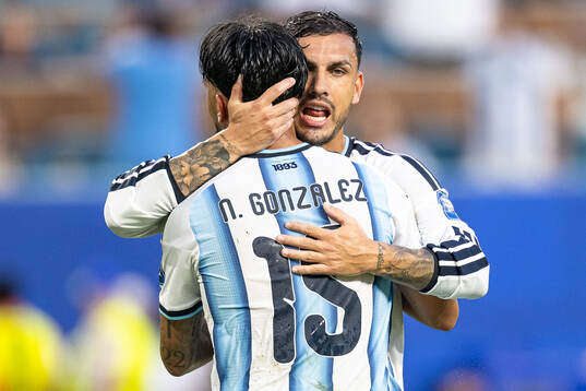Cristian Romero and Leandro Paredes of Argentina