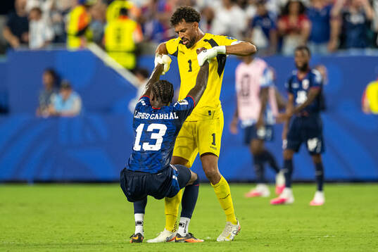 Sidny Lopes Cabral and goalkeeper Vozinha of Cabo Verde