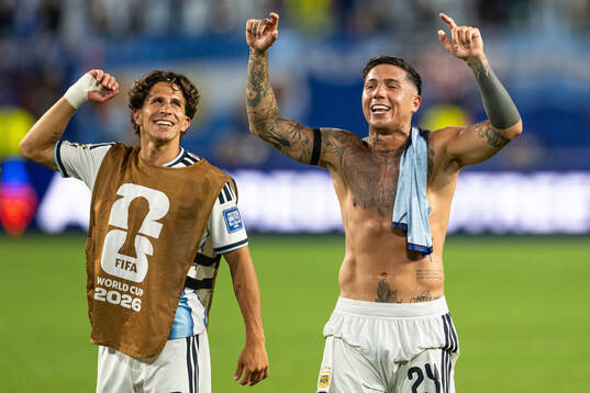 Giuliano Simeone and Enzo Fernandez of Argentina celebrate