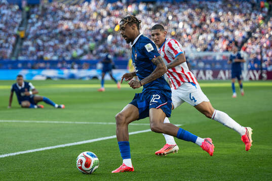 Bradley Barcola of France and Juan Jose Caceres of Paraguay
