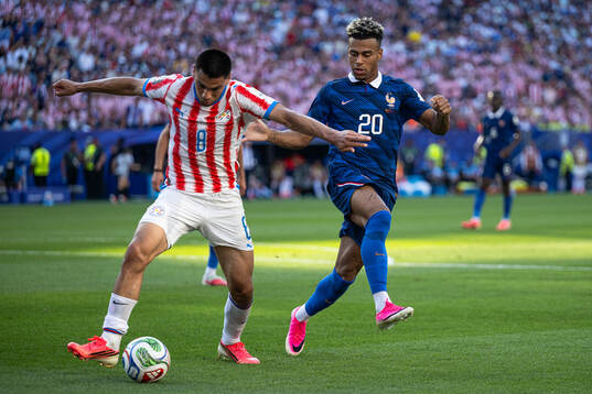 Diego Gomez of Paraguay and Desire Doue of France