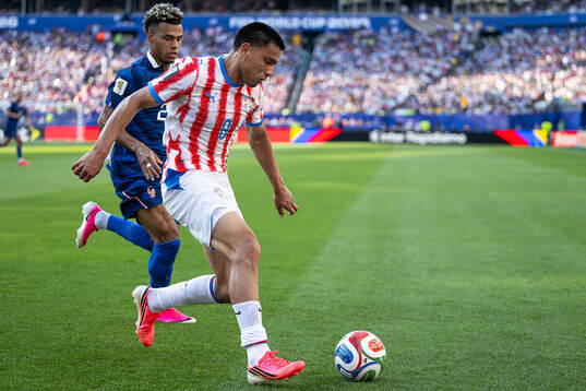 Desire Doue of France and Diego Gomez of Paraguay