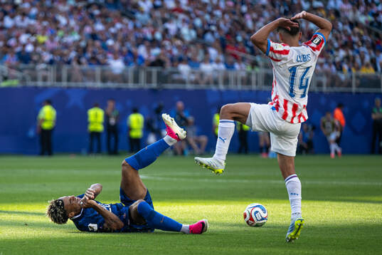 Desire Doue of France and Andres Cubas of Paraguay