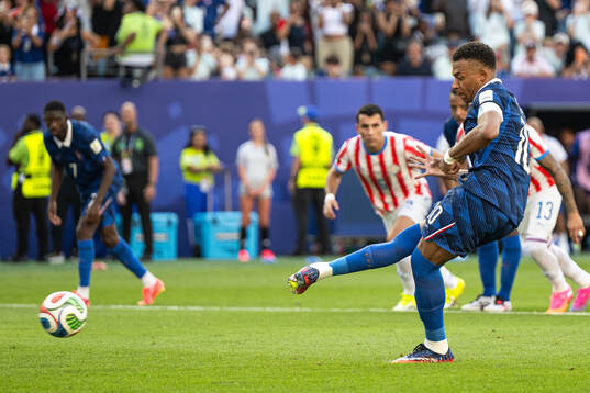 Kylian Mbappe of France scores the 0-1 goal