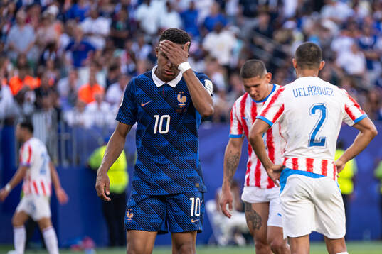 Kylian Mbappe of France looks dejected