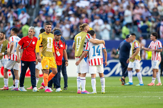 Players of Paraguay look dejected