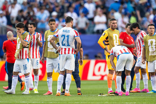 Players of Paraguay look dejected
