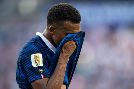 Kylian Mbappe of France looks dejected