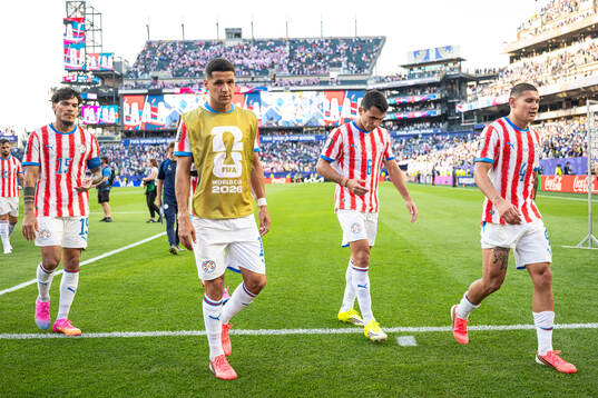 Players of Paraguay look dejected