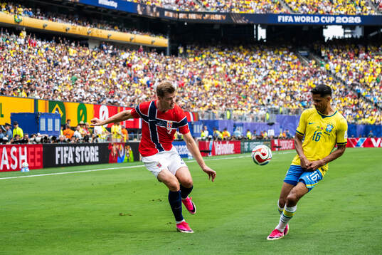 Alexander Sørloth of Norway and Douglas Santos of Brazil