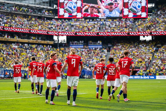 Patrick Berg and Erling Braut Haaland of Norway celebrate
