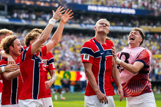 Erling Braut Haaland of Norway celebrates with teammate