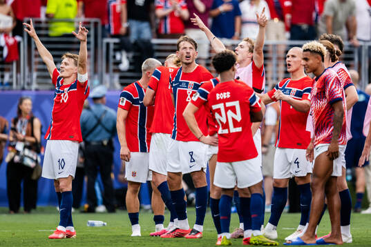 Martin Ødegaard of Norway celebrate with team mates